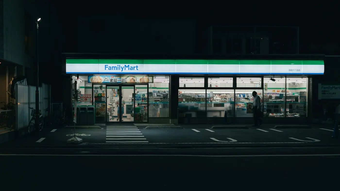 A convenience store lit up at night