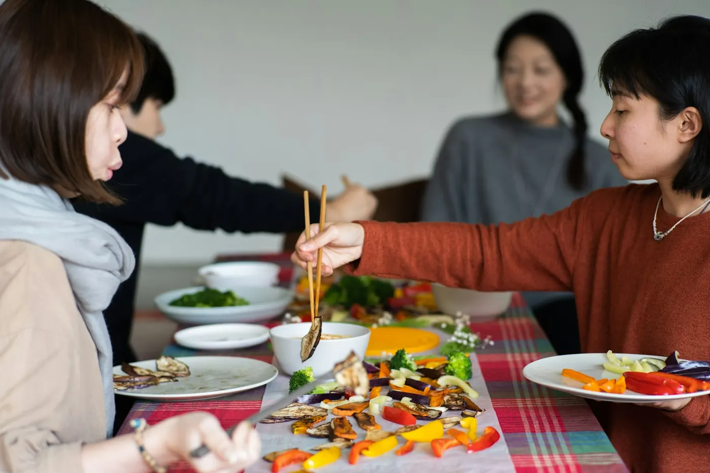 Friends sharing dishes around a table