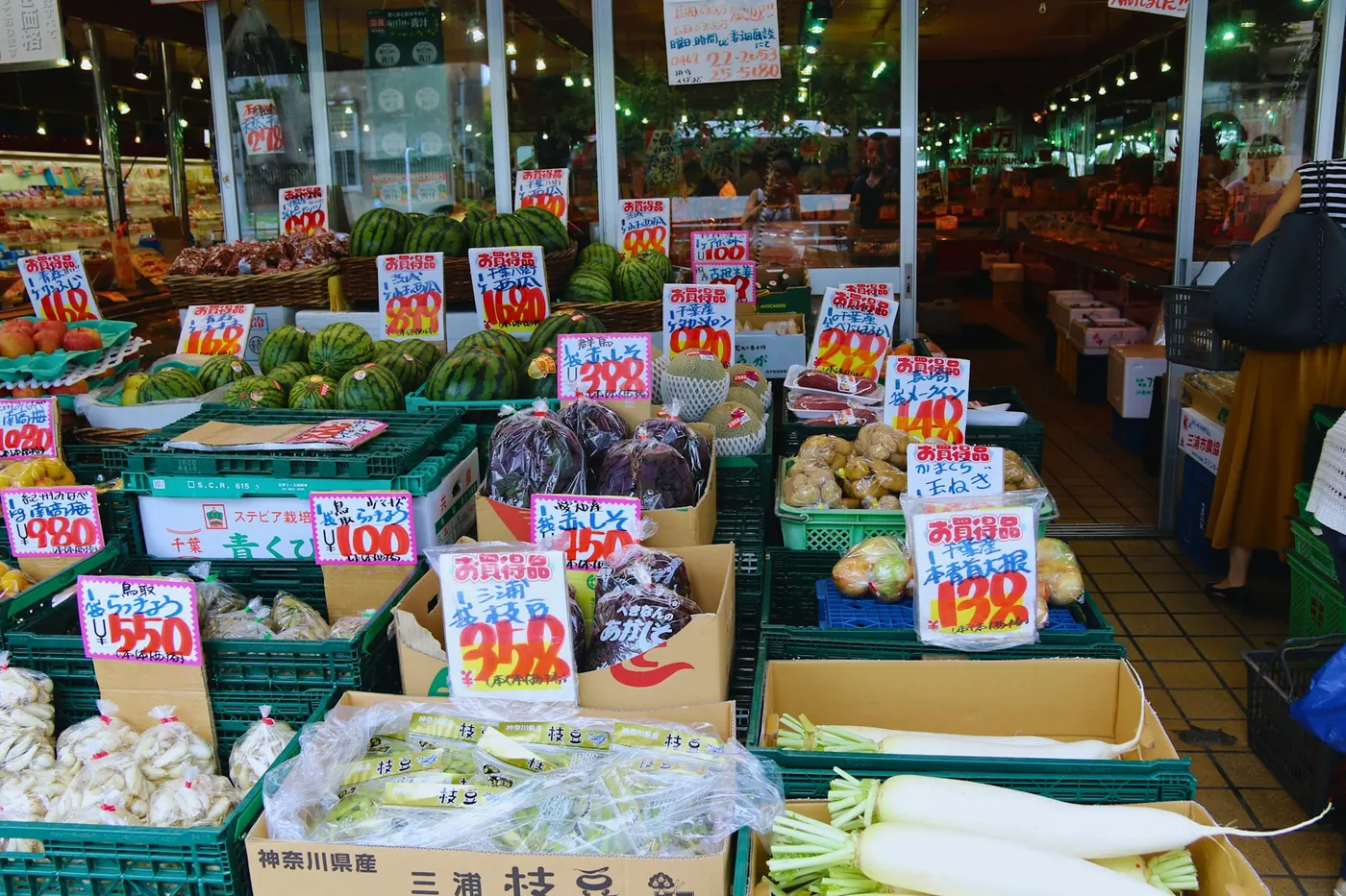 Fresh vegetables with price tags at a Japanese market