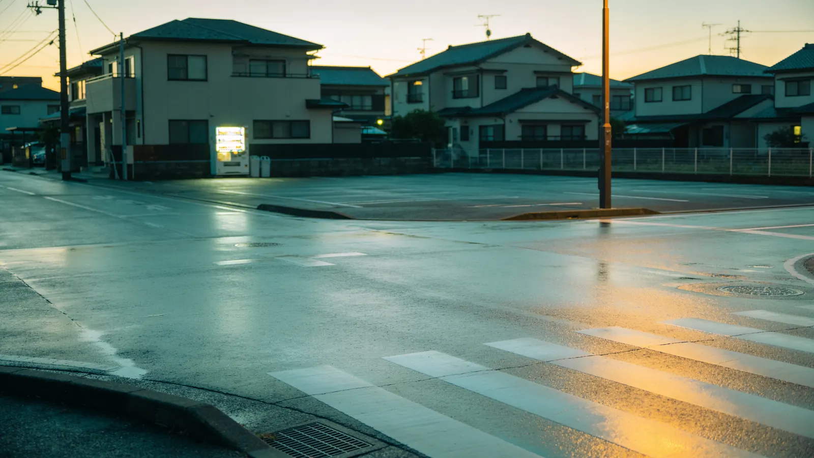 An empty street in a Japanese town at dusk, after the call centre has closed
