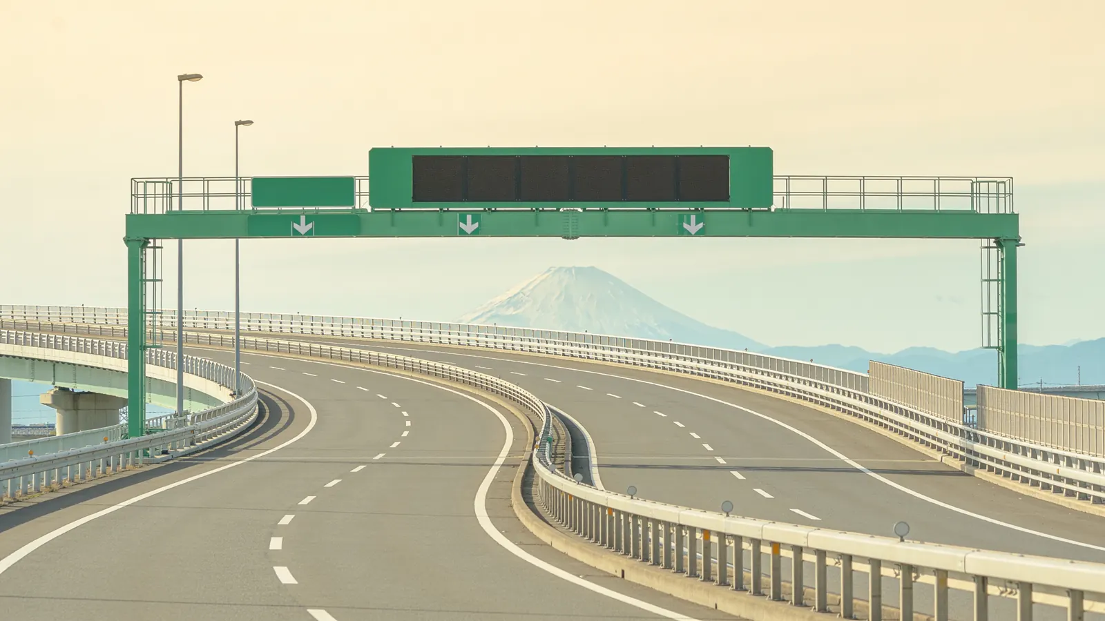 An expressway curving towards Mount Fuji