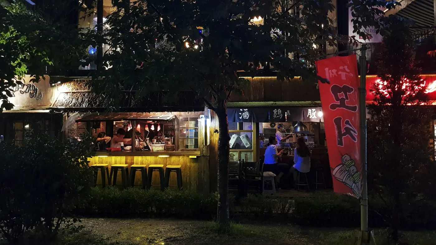 People at an izakaya at night
